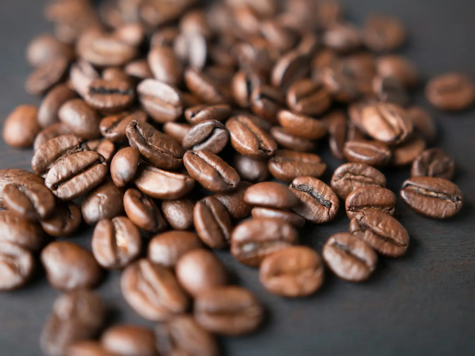 A pile of freshly roasted coffee beans