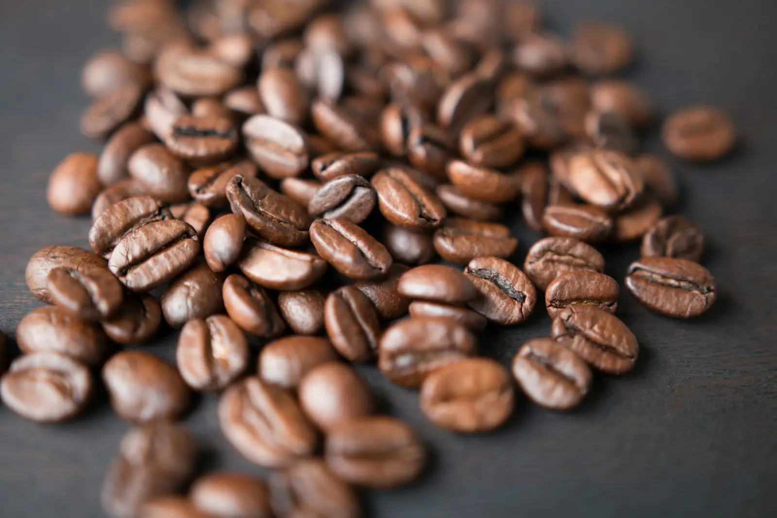 A pile of freshly roasted coffee beans